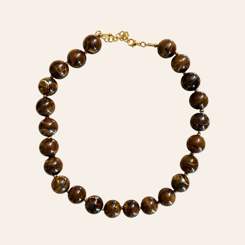 Brown beaded necklace on a beige background Mimi Necklace - Brown
